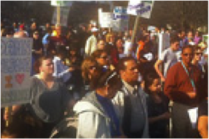 Lawrence residents protest Boston Magazine headquarters following “The City of the Damned” publication (Photo credit: WBUR)