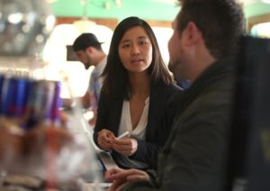 Photo by Pat Greenhouse/Boston Globe Staff. Michelle Wu speaks with community members during a campaign event at Victoria's Diner November 2015.